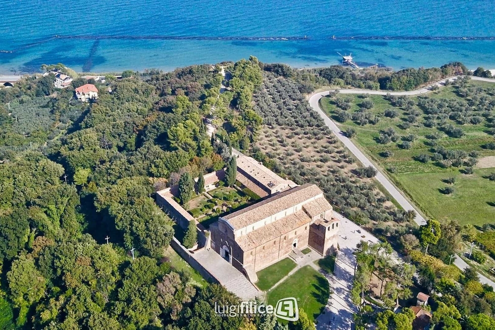 aerial view of Italian abbey showing setting - in olive groves near the sea