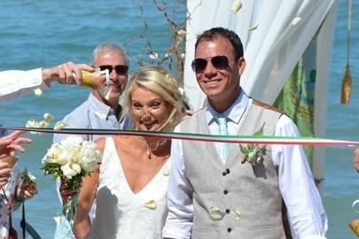 Aline and Chris getting married on a beach in Italy