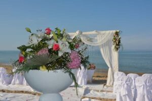 beach wedding ceremony with floral decorations