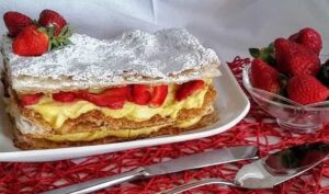 Mille Foglie Italian wedding cake serving with strawberries