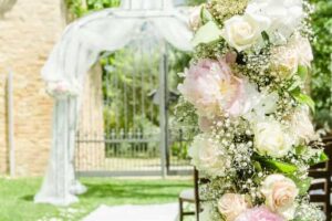 flowers decorating a wedding ceremony arch