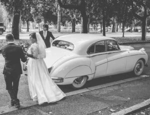 bride and white wedding limousine