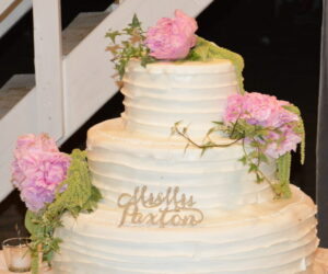 decorated white iced Italian wedding cake with pink flowers