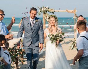 wedding couple in legal wedding ceremony on beach in Italy