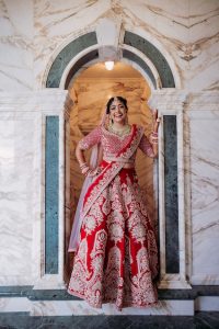 Bride in red dress at Indian wedding in Italy
