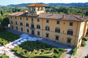 Large Tuscan villa pictured from the air.
