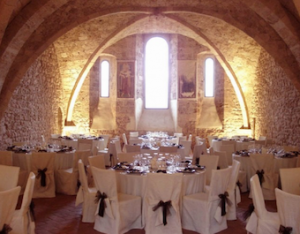 Wedding in a grand abbey. Wedding banquet set up at Abbazia di san Pastore