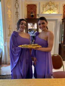 Traditionally dressed greeters welcome guests to an Indian wedding in Italy