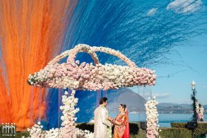 Spectacular multi coloured smoke bomb goes off at a Hindu wedding at Lake Maggiore in Italy.